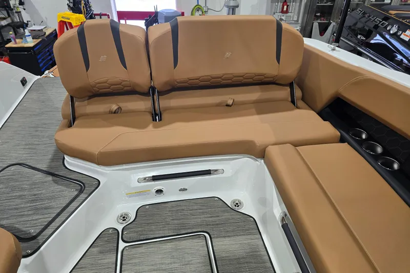 Slide: The Image of 2026 Four Winns H6 boat interior with tan seating and modern design. - 17