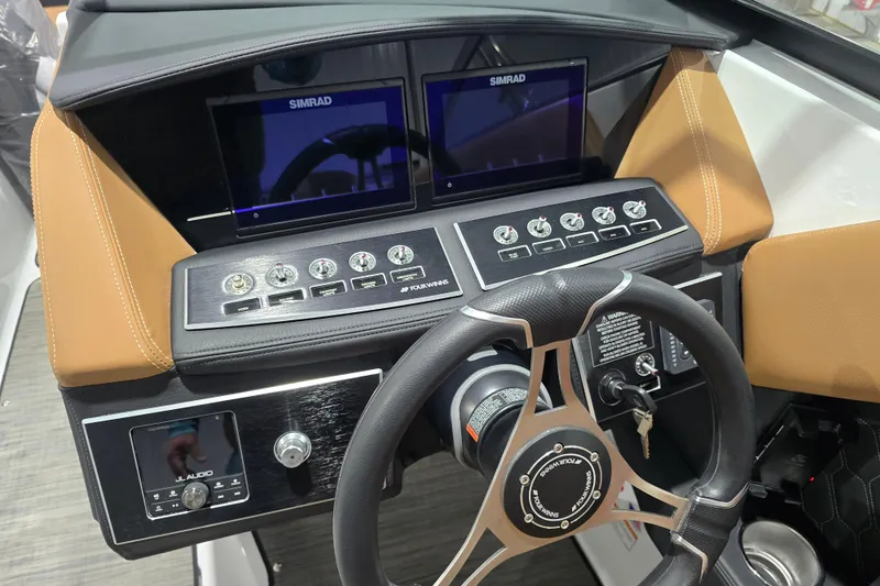 Slide: The Image of 2026 Four Winns H6 boat dashboard with dual Simrad displays and JL Audio system. - 20