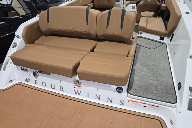 Slide: The Image of 2026 Four Winns H6 boat with tan seating and sleek design. - 6