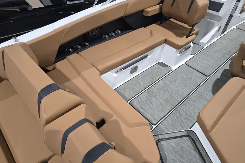 Slide: The Image of Luxurious interior of 2026 Four Winns H6 boat with tan seating and modern design. - 7