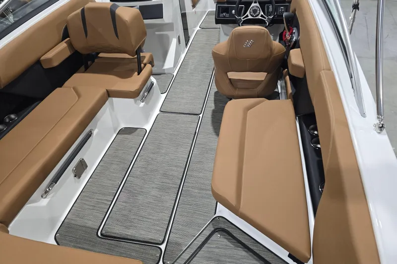 Slide: The Image of 2026 Four Winns H6 boat interior with tan seating and modern design. - 8