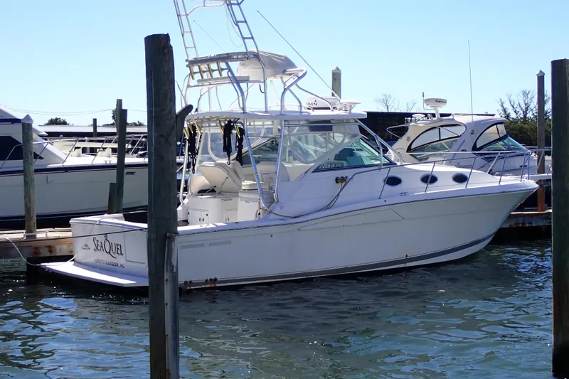 The Image of 2006 Wellcraft 330 Coastal boat docked in marina, side view. - 0