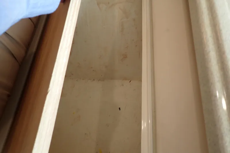 Slide: The Image of Storage compartment inside 2006 Wellcraft 330 Coastal boat, showing interior details. - 100