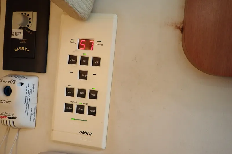 Slide: The Image of Control panel on 2006 Wellcraft 330 Coastal boat, displaying temperature settings. - 101