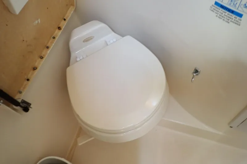 Slide: The Image of Toilet in 2006 Wellcraft 330 Coastal boat bathroom interior. - 104