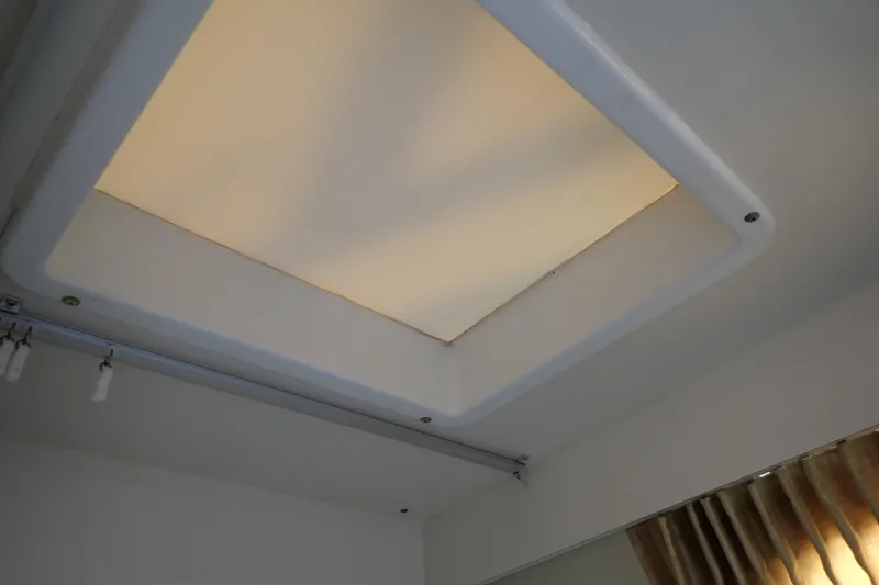 Slide: The Image of Ceiling light fixture inside 2006 Wellcraft 330 Coastal boat cabin. - 111