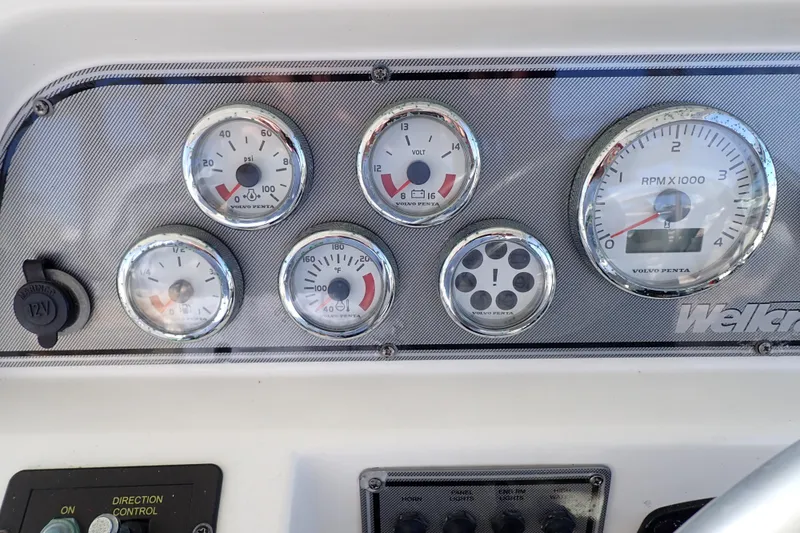 Slide: The Image of Dashboard of a 2006 Wellcraft 330 Coastal boat with Volvo Penta gauges. - 115