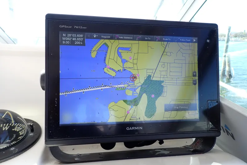 Slide: The Image of Garmin GPS display on 2006 Wellcraft 330 Coastal boat, showing navigation map. - 121
