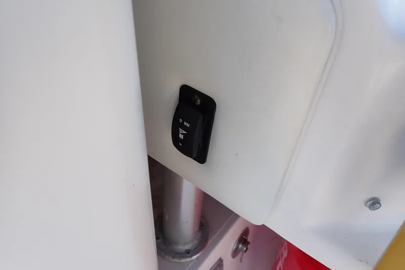 Slide: The Image of Switch panel on 2006 Wellcraft 330 Coastal boat, featuring a toggle switch. - 125