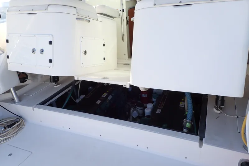 Slide: The Image of 2006 Wellcraft 330 Coastal boat engine compartment with open access panels. - 126