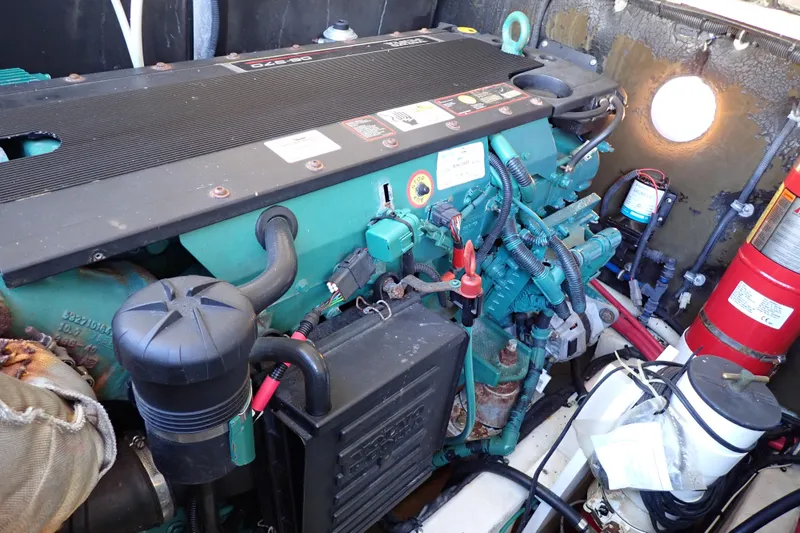 Slide: The Image of Engine compartment of a 2006 Wellcraft 330 Coastal boat, featuring a Volvo Penta engine. - 130