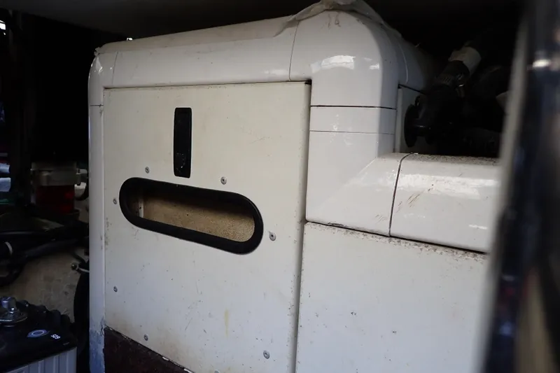 Slide: The Image of Engine compartment of a 2006 Wellcraft 330 Coastal boat, showing machinery and components. - 135