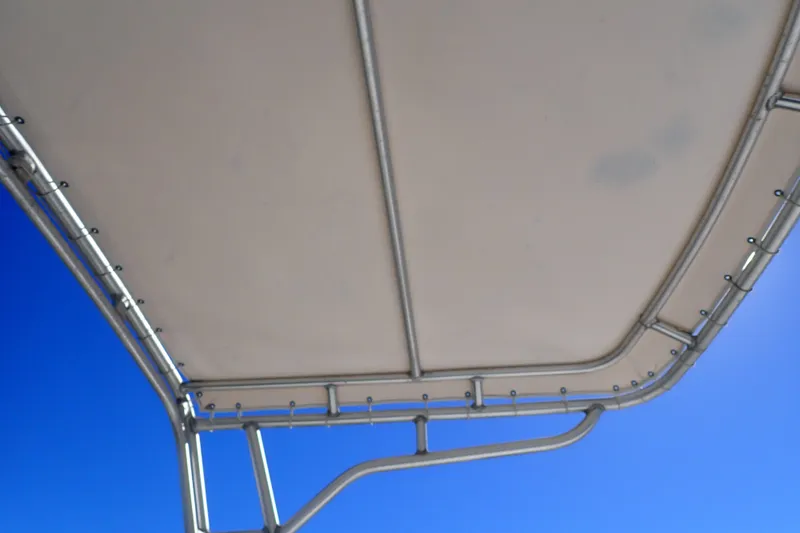 Slide: The Image of T-top canopy of 2006 Wellcraft 330 Coastal boat against clear blue sky. - 16