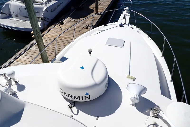 Slide: The Image of 2006 Wellcraft 330 Coastal boat deck with Garmin equipment, docked at marina. - 17