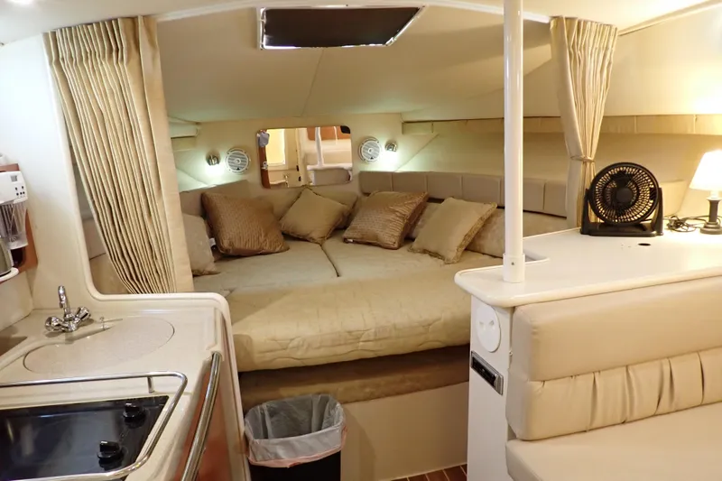 Slide: The Image of Interior of 2006 Wellcraft 330 Coastal boat with cozy bed and kitchenette. - 35