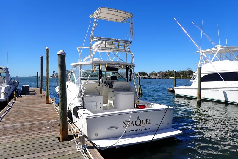 Slide: The Image of 2006 Wellcraft 330 Coastal boat docked at marina, clear blue sky, Safety Harbor, FL. - 4