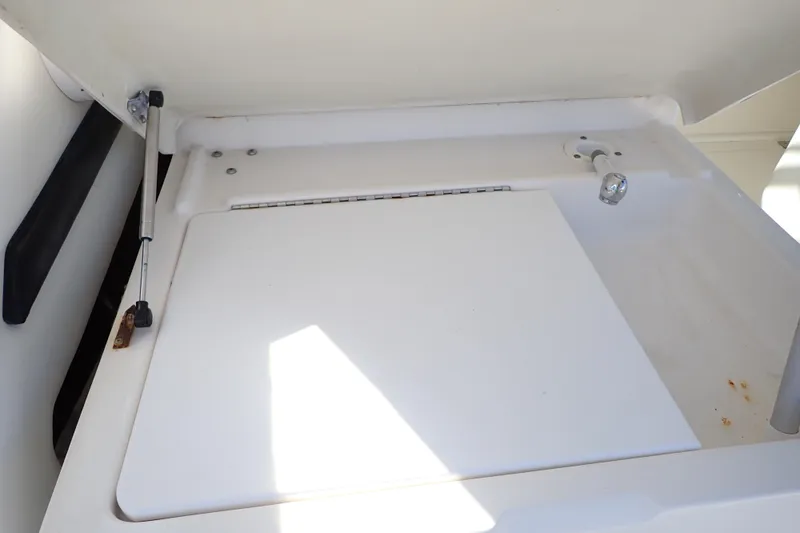 Slide: The Image of Open storage compartment on 2006 Wellcraft 330 Coastal boat, featuring hydraulic support. - 41