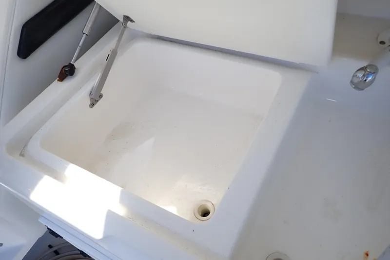 Slide: The Image of Open storage compartment on 2006 Wellcraft 330 Coastal boat. - 42