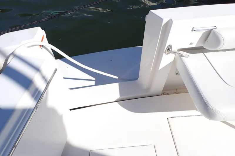 Slide: The Image of 2006 Wellcraft 330 Coastal boat deck with white seating and water view. - 49