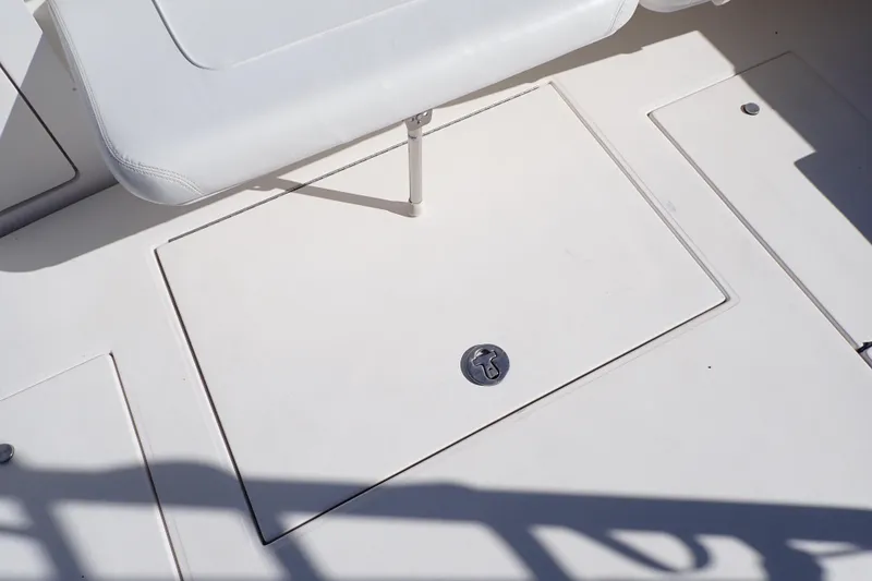 Slide: The Image of 2006 Wellcraft 330 Coastal boat deck with storage hatch and seating. - 55