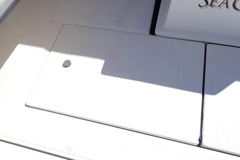 Slide: The Image of 2006 Wellcraft 330 Coastal boat deck with storage compartment. - 59