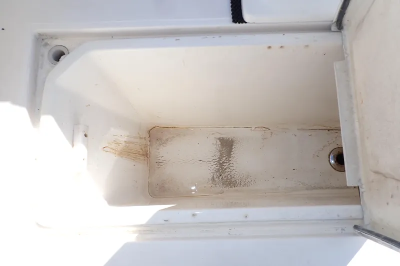 Slide: The Image of Empty storage compartment on a 2006 Wellcraft 330 Coastal boat. - 60