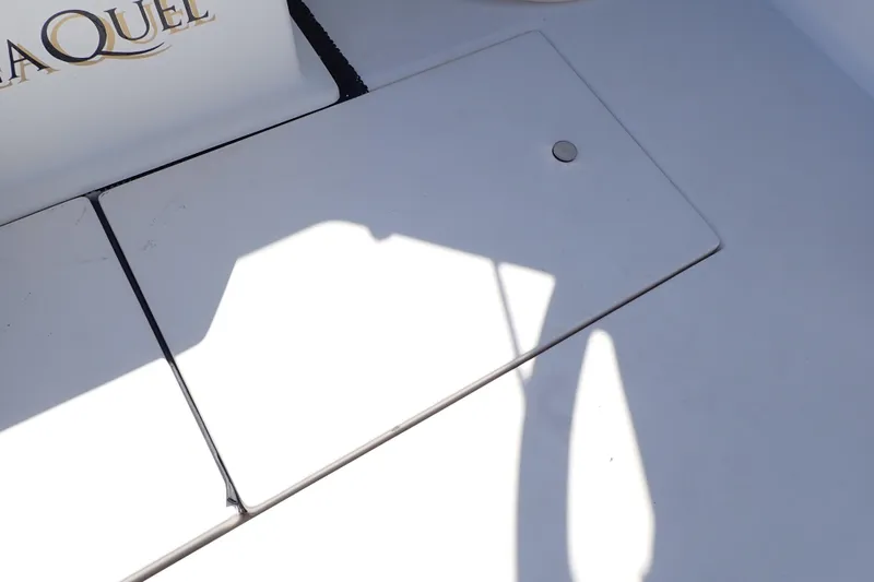 Slide: The Image of 2006 Wellcraft 330 Coastal boat deck with storage hatch and shadow. - 61