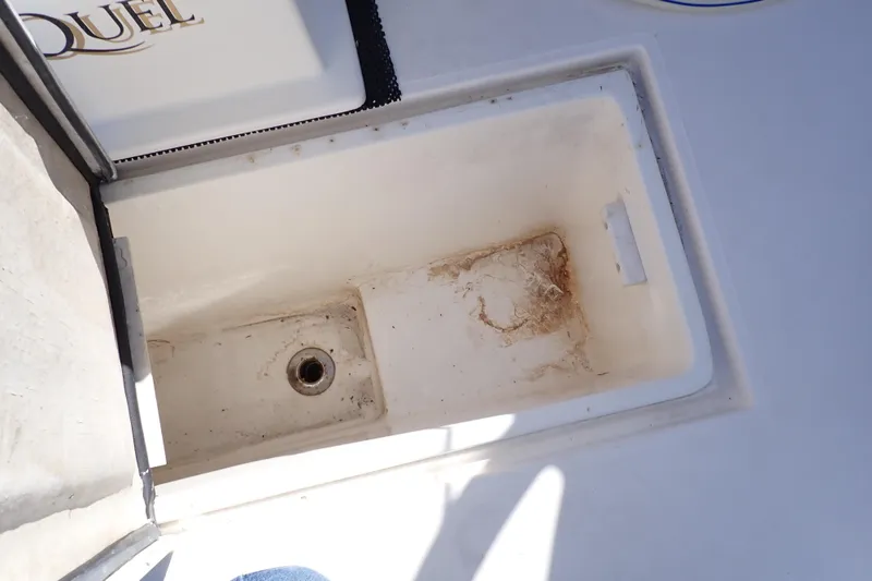 Slide: The Image of Open storage compartment on 2006 Wellcraft 330 Coastal boat, showing interior details. - 62