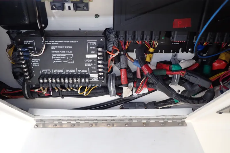 Slide: The Image of Electrical panel and wiring inside a 2006 Wellcraft 330 Coastal boat. - 69
