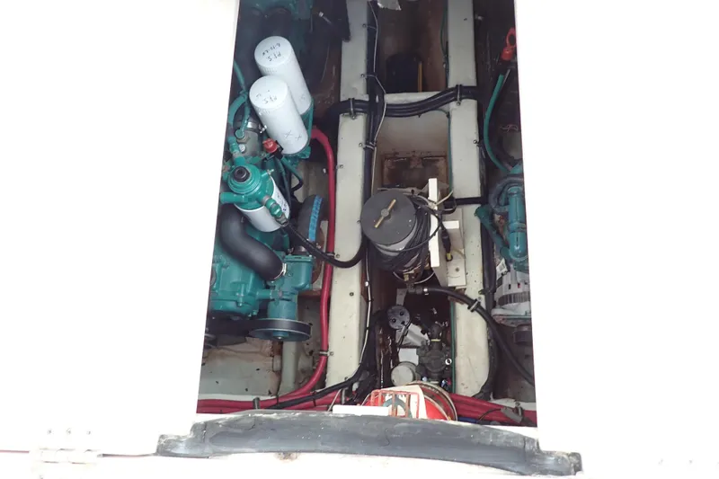 Slide: The Image of Engine compartment of a 2006 Wellcraft 330 Coastal boat, showcasing mechanical components. - 74