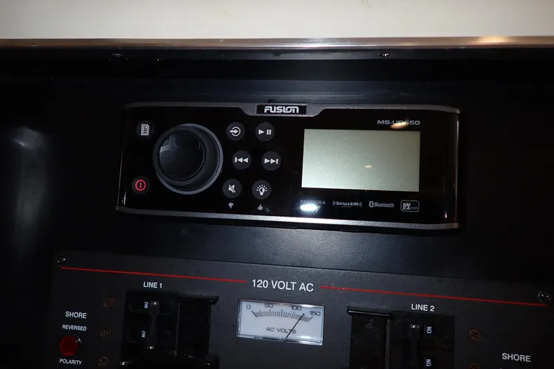 Slide: The Image of Control panel of a 2006 Wellcraft 330 Coastal boat with Fusion MS-UD650 stereo system. - 78