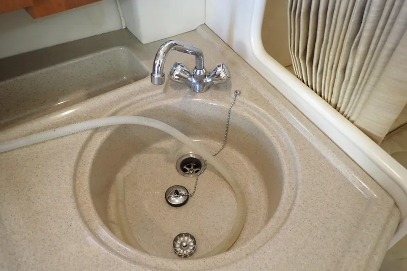 Slide: The Image of Sink and faucet in 2006 Wellcraft 330 Coastal boat interior. - 86