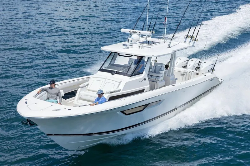 The Image of Manufacturer Provided Image: 2026 Pursuit S 388 Sport boat cruising on open water, featuring sleek design and powerful engines. - 0