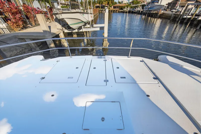 Slide: The Image of 2024 Leopard 46 Powercat deck view at marina, showcasing sleek design and spacious layout. - 17