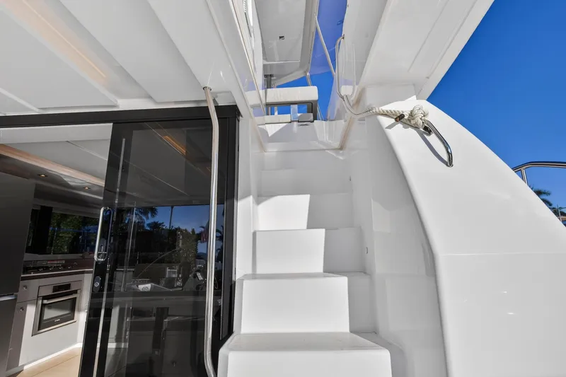 Slide: The Image of Staircase on 2024 Leopard 46 Powercat yacht with sleek design and modern interior. - 18