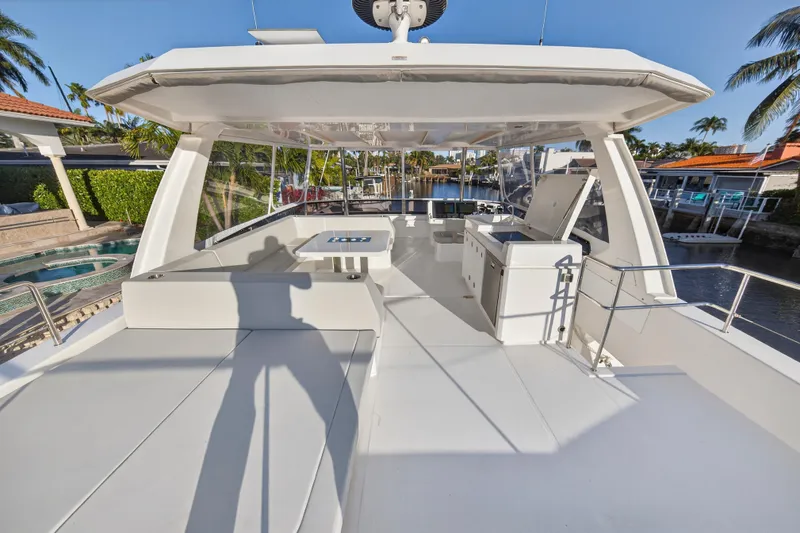 Slide: The Image of 2024 Leopard 46 Powercat yacht deck with seating and outdoor kitchen. - 34