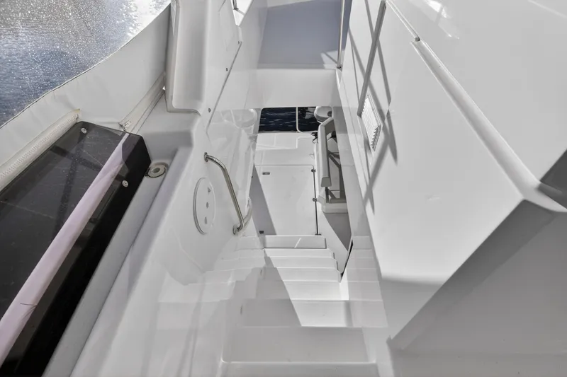 Slide: The Image of Staircase on 2024 Leopard 46 Powercat yacht, featuring sleek white design and modern railing. - 35
