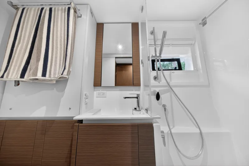 Slide: The Image of Modern bathroom in 2024 Leopard 46 Powercat yacht with sleek fixtures and striped towel. - 54