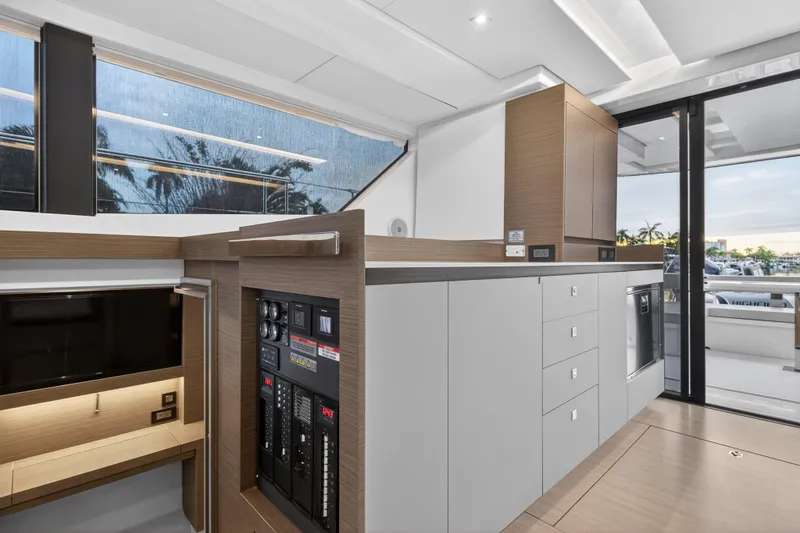 Slide: The Image of Modern interior of 2024 Leopard 46 Powercat yacht with sleek cabinetry and control panel. - 74