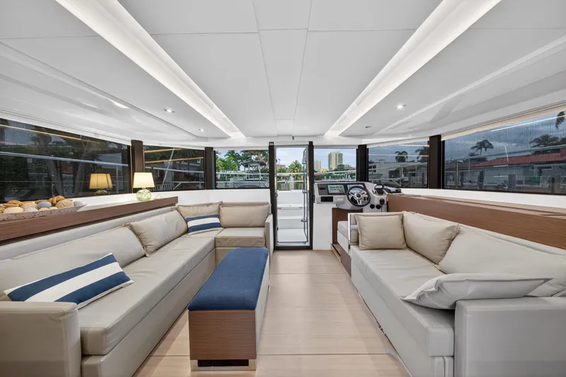 Slide: The Image of Luxurious interior of 2024 Leopard 46 Powercat yacht with modern seating and panoramic windows. - 77