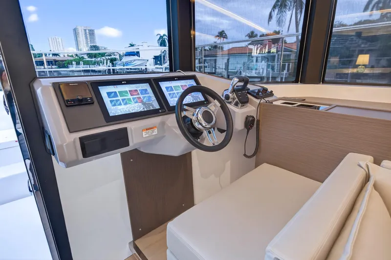 Slide: The Image of 2024 Leopard 46 Powercat helm with modern navigation screens and comfortable seating. - 85