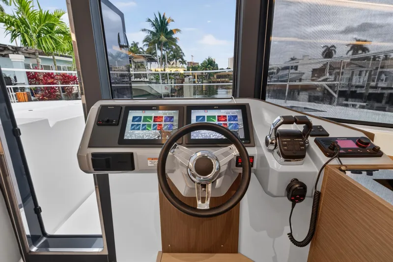 Slide: The Image of Helm station of 2024 Leopard 46 Powercat with modern controls and dual displays. - 86