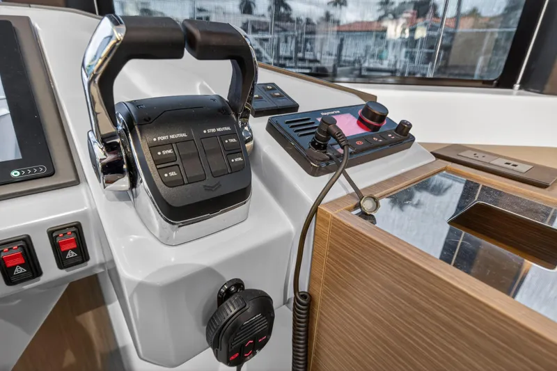 Slide: The Image of 2024 Leopard 46 Powercat helm controls with modern navigation equipment. - 88