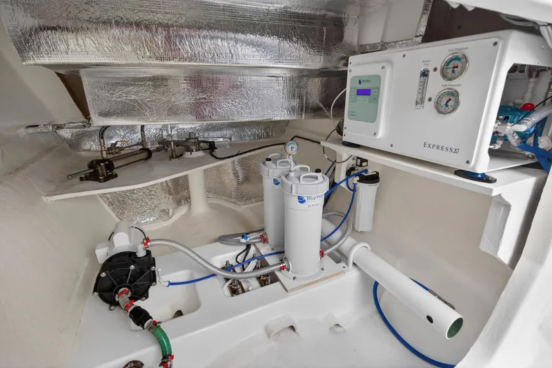 Slide: The Image of Engine room of 2024 Leopard 46 Powercat with advanced filtration system and control panel. - 98