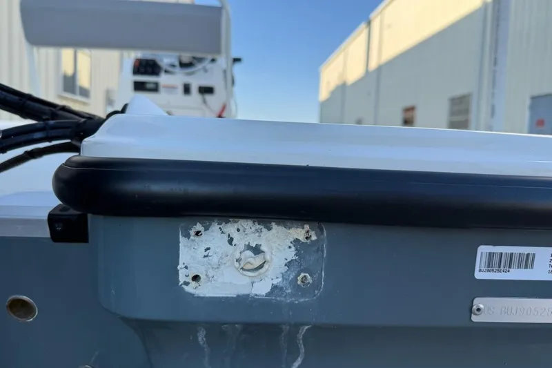 Slide: The Image of 2024 Mako 18 LTS boat detail showing mounting area and identification plate. - 10