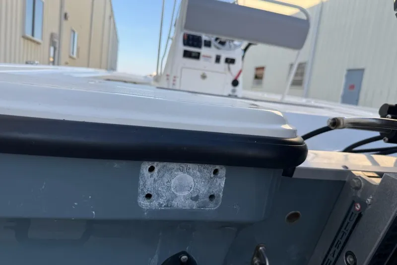 Slide: The Image of 2024 Mako 18 LTS boat detail with control panel and exterior view. - 11