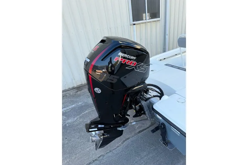 Slide: The Image of 2024 Mako 18 LTS boat with Mercury Pro XS outboard motor. - 13