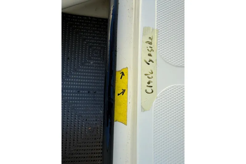Slide: The Image of Crack on 2024 Mako 18 LTS boat, marked with tape and arrows. - 22