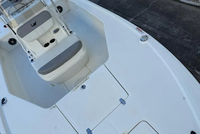 Slide: The Image of 2024 Mako 18 LTS boat interior with seating and storage compartments. - 5