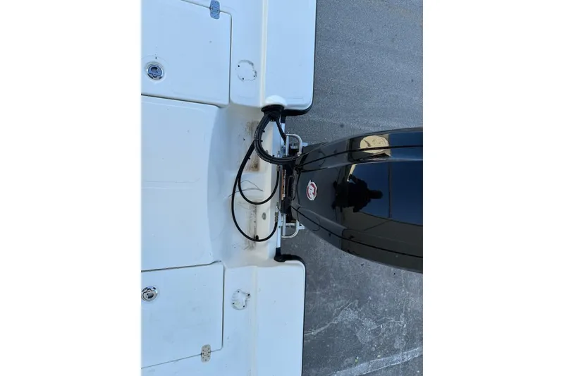 Slide: The Image of Top view of a 2024 Mako 18 LTS boat's motor and deck. - 9